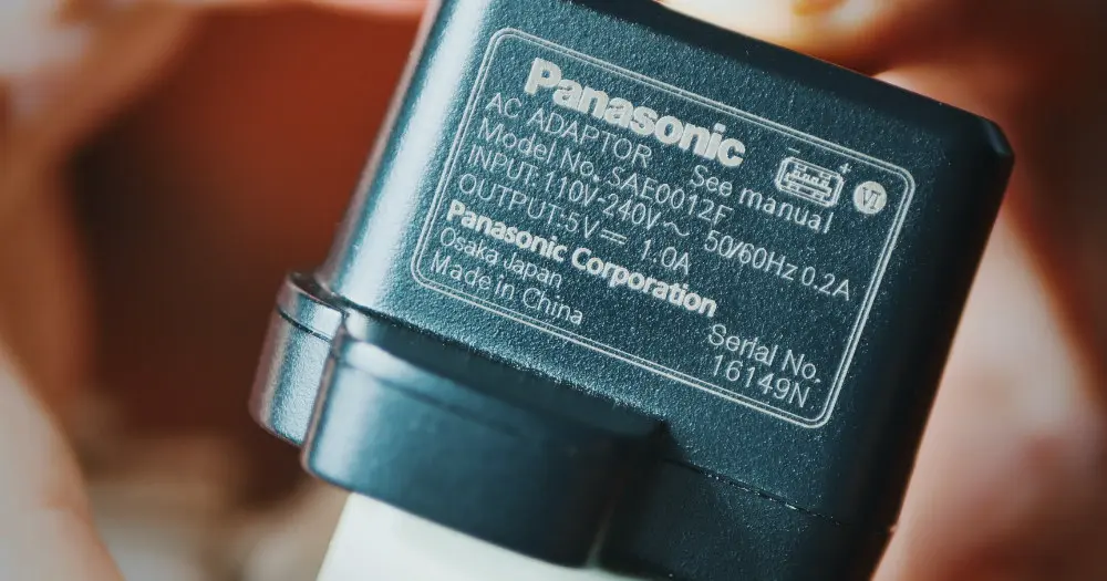 Always check the charger! This camera adaptor shows 110V–240V.